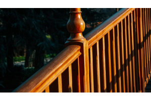 luxury brown decking rail with spindle in the sunset